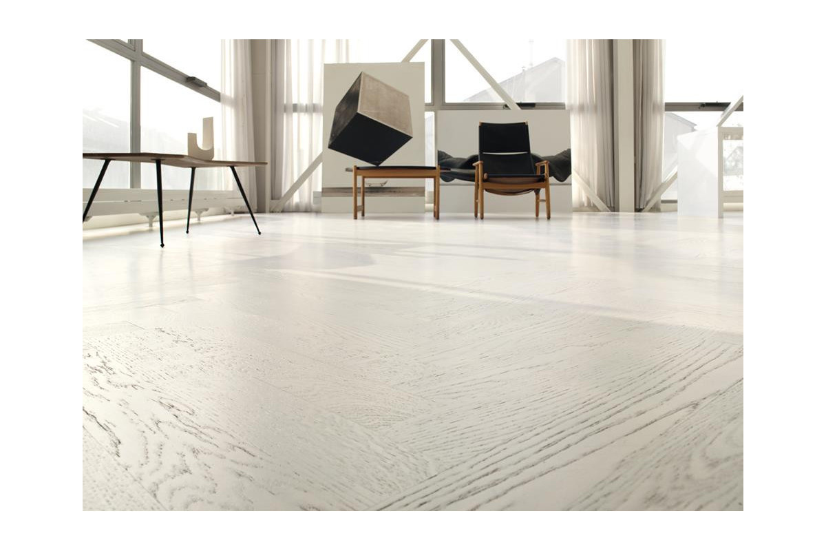 Choosing white wood flooring - this white herringbone floor is also available as planks and provides a stunning backdrop for your interior designs