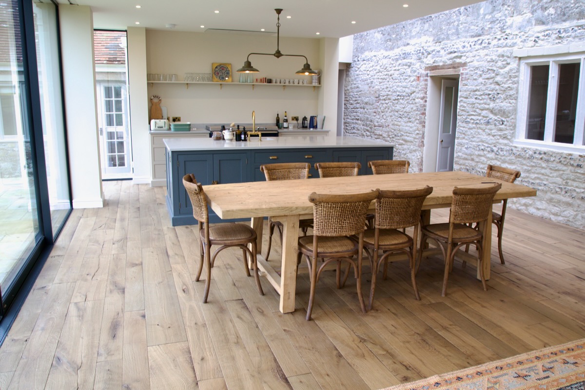 worn oak flooring in dining room